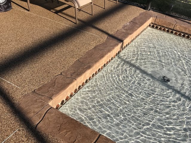Pool coping in decorative concrete